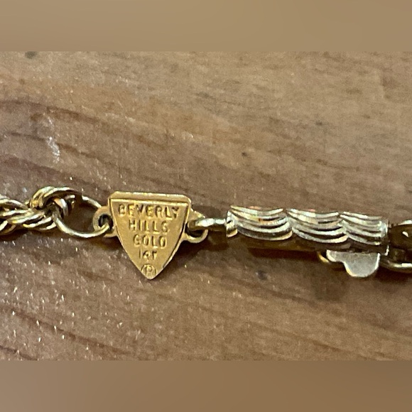 Beverly Hills Gold: 14k.Puffy triple heart rose gold, yellow gold rope bracelet. - Picture 4 of 10